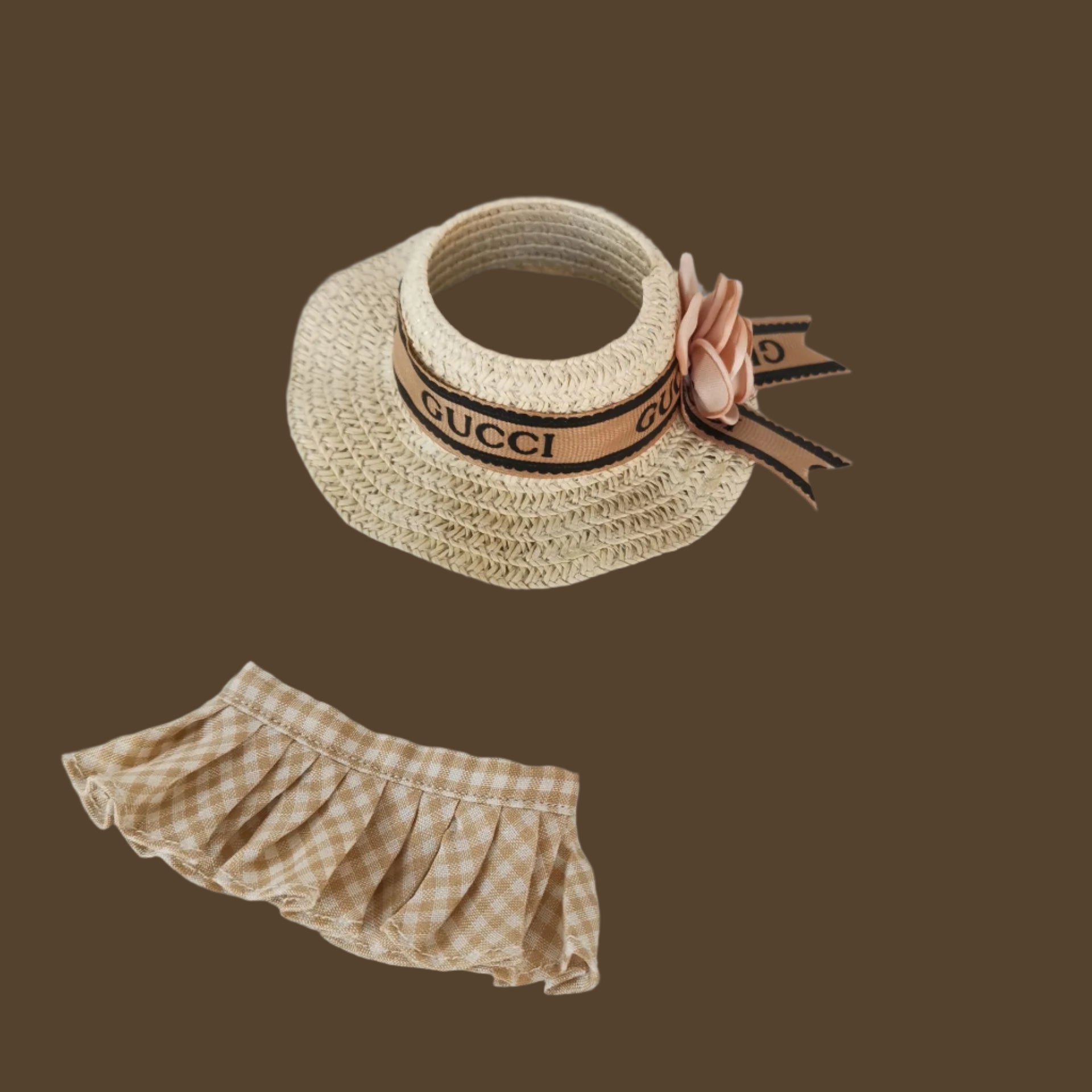 Straw hat with Gucci logo and checkered bloomers on a light gray background